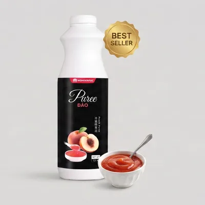 White Wonderful bottle with a black label reading Puree Đào, beside a small bowl of thick peach puree with a spoon.